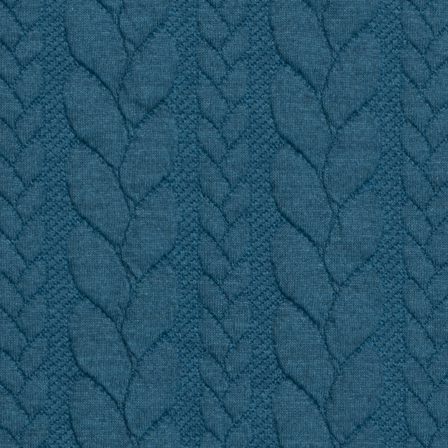 A Close Up Of The Teal Cable Knit Fabric